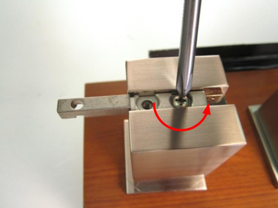 To remove the handle base, locate the set screw that attaches the handle base to the faucet. Remove the screw by using the hex wrench to turn the screw counter clockwise.