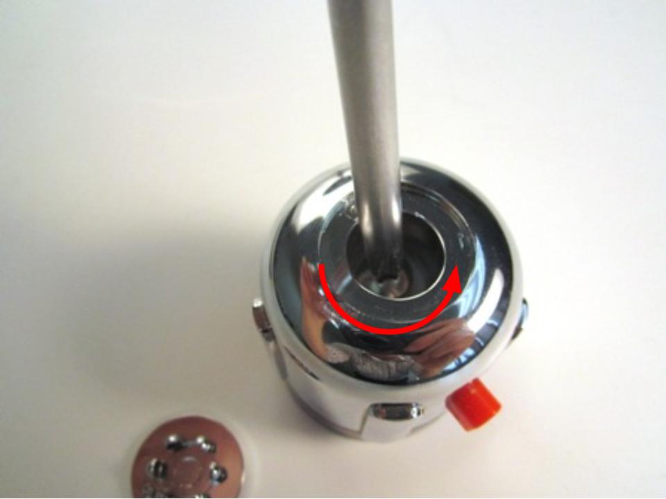 Use a screwdriver to remove the screw. Turn counter clockwise to remove the screw.