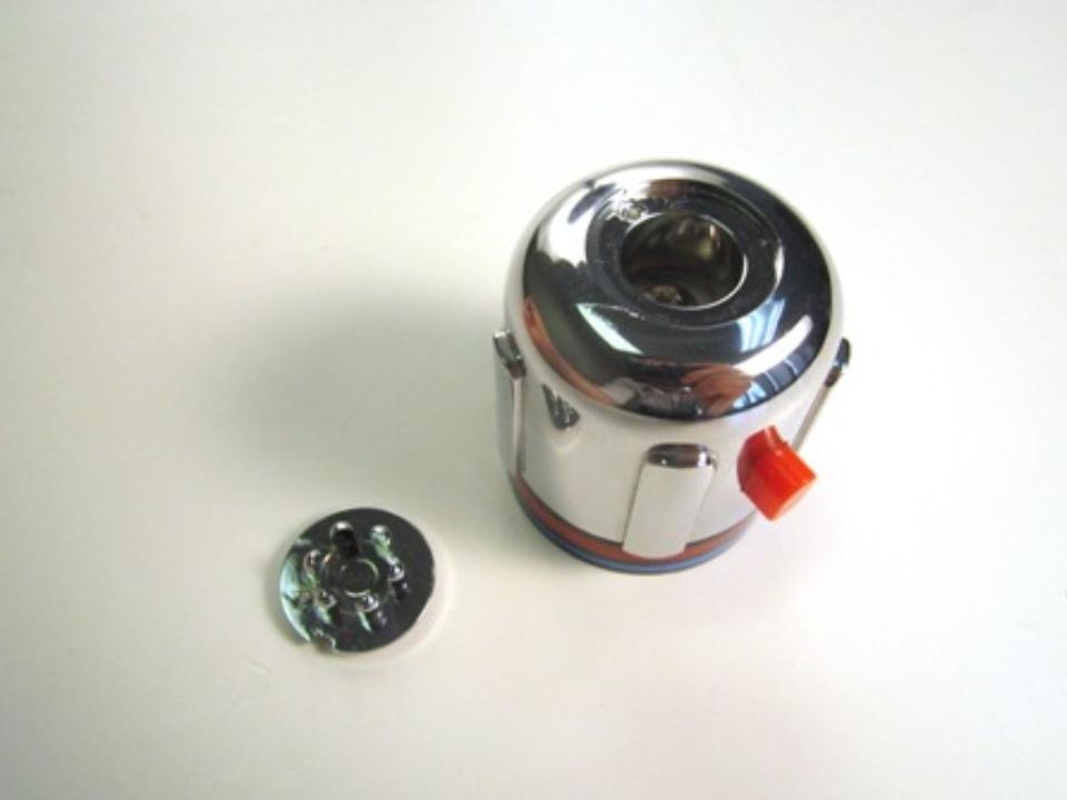 Remove the handle cap. To do so, use a flat head screwdriver to pop out the handle cap.