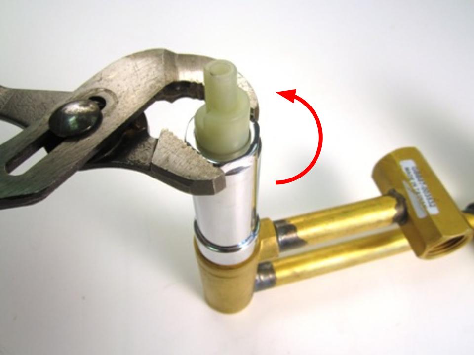  After removing the handle, remove the threaded sleeve by twisting counter clockwise with a wrench.