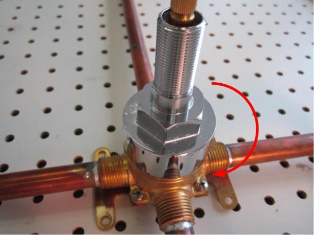 Re-install the base nut with a pair of adjustable pliers. In order to avoid over tightening the base nut, hand tighten the base nut, and then use the adjustable pliers to apply a quarter turn. Approximately 10-14 lbs of torque are required to properly install the base nut.