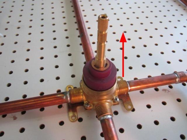 Hold the stem of the cartridge and pull out until the cartridge is completely removed from the faucet body.