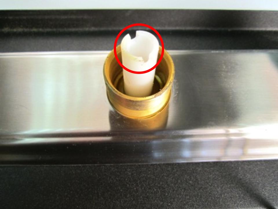 Once the spout has been removed, the top of the diverter should be visible. Locate the two openings and insert a flat tool or object. Turn counter clockwise until it is completely removed from the faucet body.
