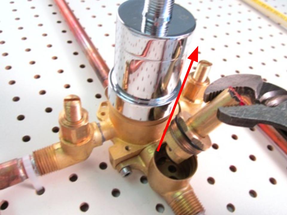 Once the retainer nut is removed, pull the diverter out of the faucet body in order to remove it.