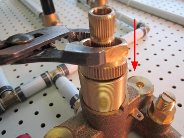 To remove the cartridge, use the sleeve removal tool. To do so, slide the sleeve removal tool onto the cartridge assembly