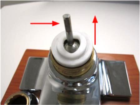 After removing the handle, remove the trim cap and locking nut by unscrewing the trim cap counter-clockwise.