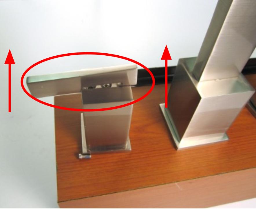 Once the set screw is loosened, slide the handle stem towards the spout and then push down on the end of the handle stem.