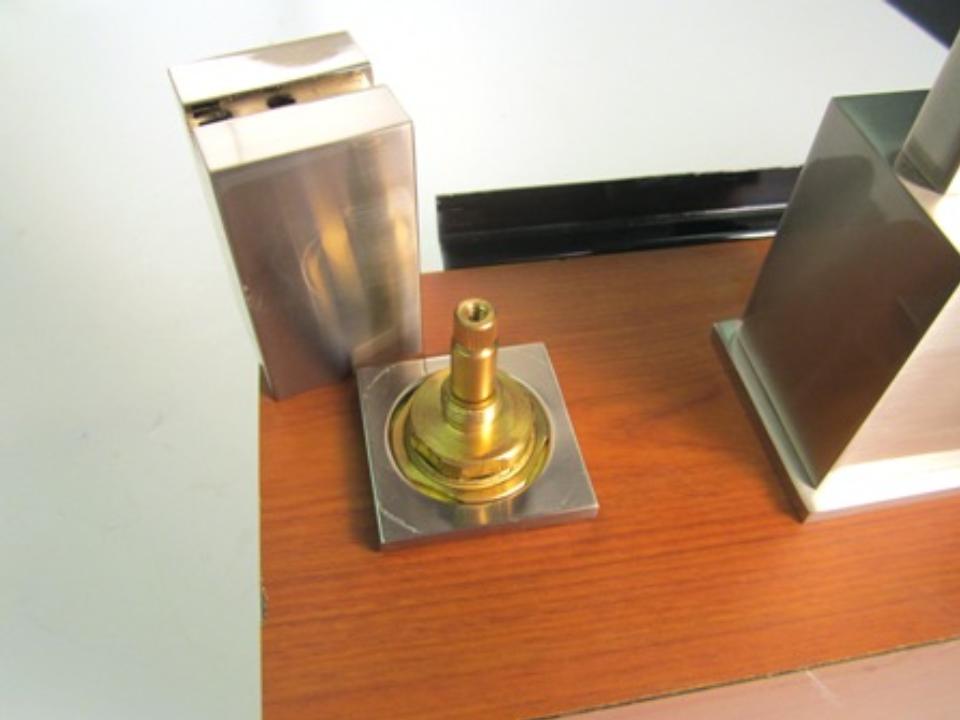 Once the set screw is loosened, pull the handle base away from the faucet. The handle base should come off easily.